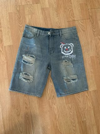 Shorts vaqueros con rotos y dibujo