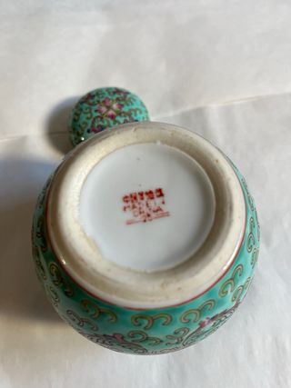 Tibor chino verde con flores