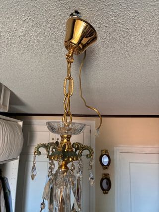 Lámpara de araña de cristal y metal