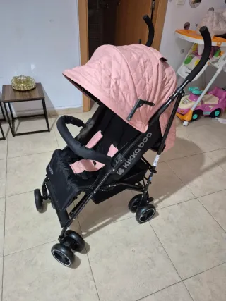 Carrito de bebé rosa y negro