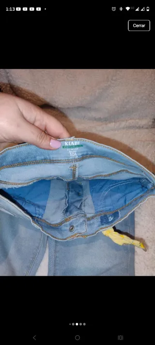 Vaqueros niña desgastados