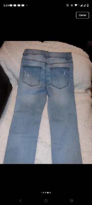 Vaqueros niña desgastados