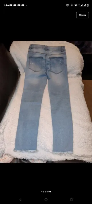 Vaqueros niña desgastados