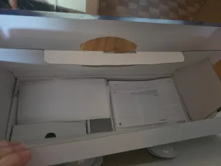 Caja PS5 con manuales y plásticos