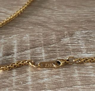 Cadena trenzada chapada en oro