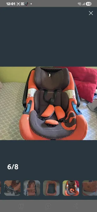 Carrito de bebé naranja con accesorios