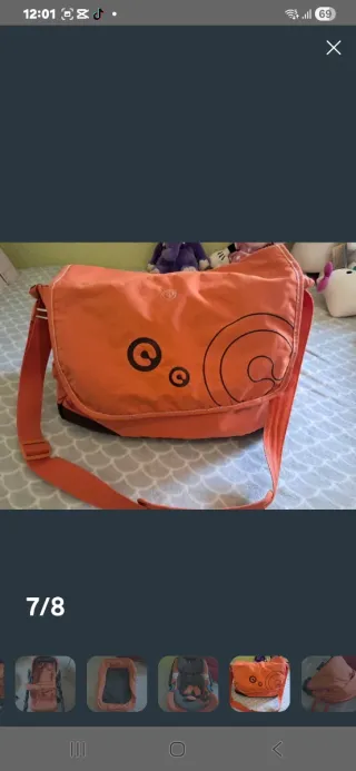 Carrito de bebé naranja con accesorios