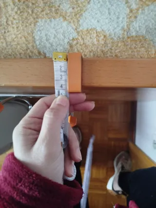 Colgador o perchero de puerta naranja y plateado