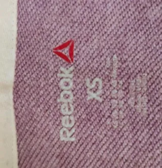 Chaqueta deportiva Reebok morada chica