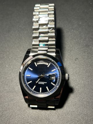 RELOJ AIMIMO CUARZO, DÍA Y FECHA, ESFERA AZUL