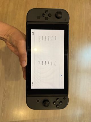 Nintendo Switch en caja original + 2 mandos extra