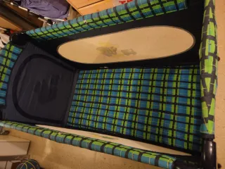 Cuna de viaje con diseño de oso y tren