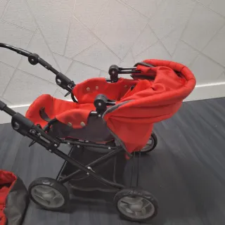 Carrito de muñecas rojo y negro