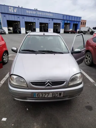 Citroen Saxo 2002, cambio por moto scuter 125.