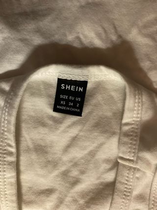 Top SHEIN bianco con croci nere XS
