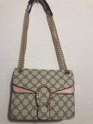 Bolso de mano con cadena dorada
