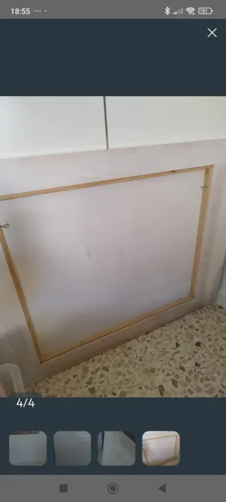 Cabecero de madera blanco.
