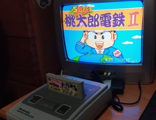 Super Famicom con 2 mandos y juego