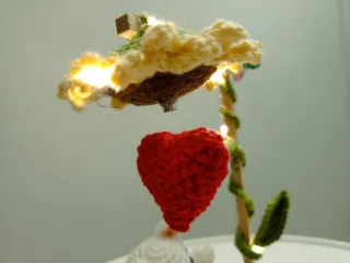 Osito de peluche con corazón y flor