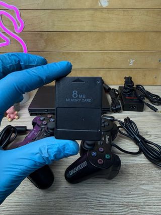 PS2 Slim nera con 2 controller e accessori