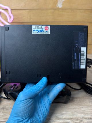 PS2 Slim nera con 2 controller e accessori