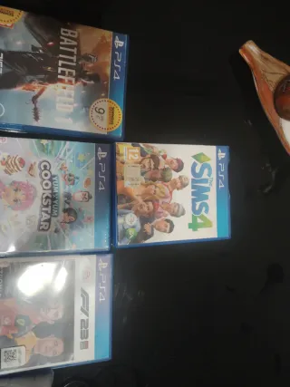 PS4 (PlayStation 4) con 3 mandos y 10 juegos