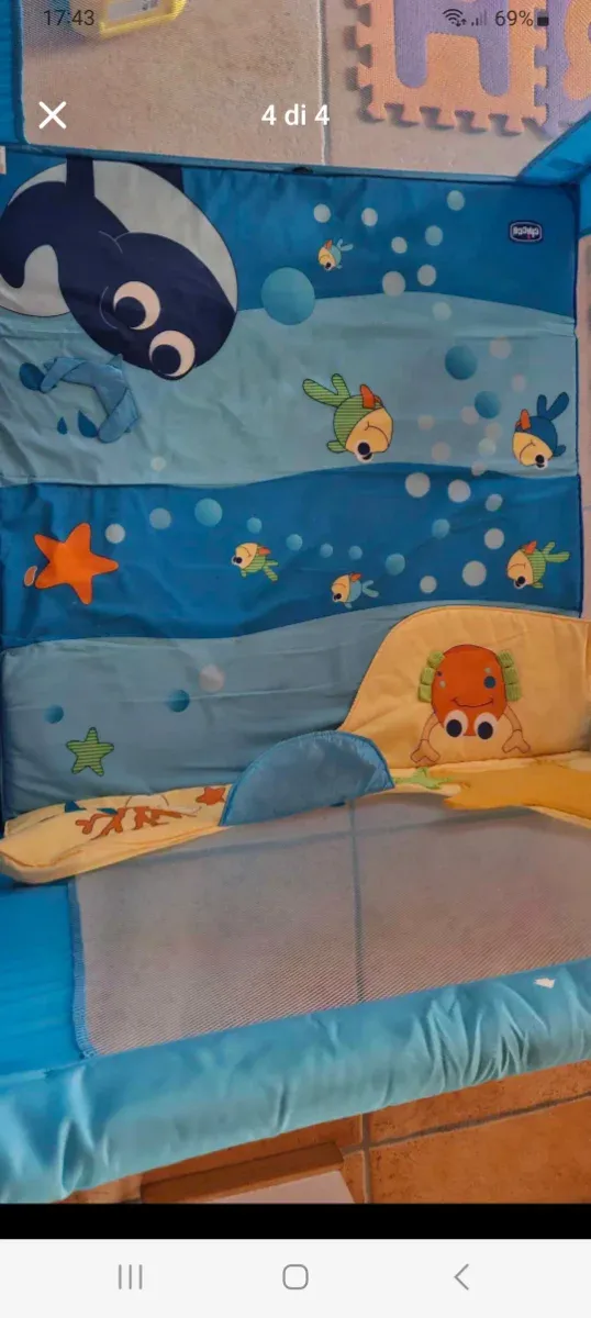 Box bimbi azzurro con disegni marca Chicco