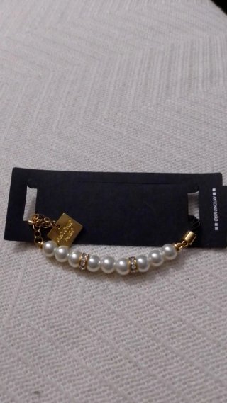 Pulsera plateada con charm de corazón
