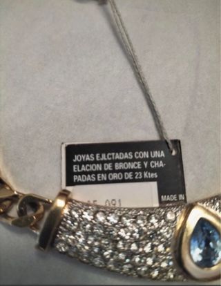 Gargantilla espectacular con piedras azules y dora