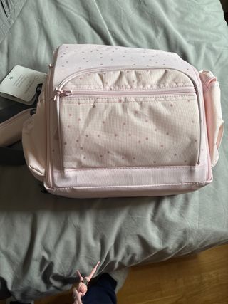 Trona de viaje rosa con estrellas