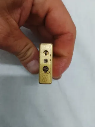 Mechero antiguo dorado con dragón