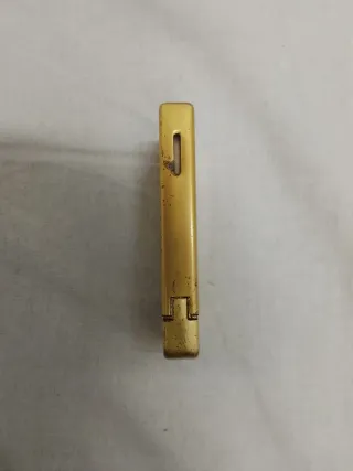 Mechero antiguo dorado con dragón