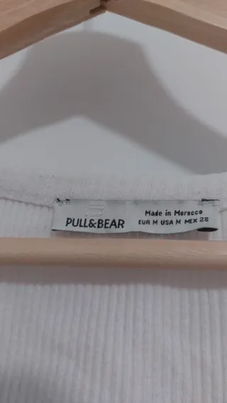 Top blanco cuello V con botones