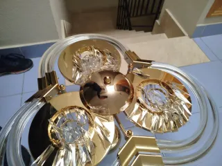 Lampada a sospensione dorata e trasparente