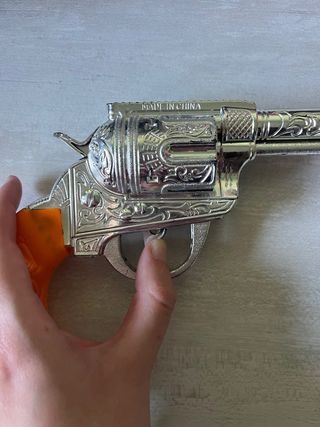 Pistola de Juguete Plateada con Mango Naranja