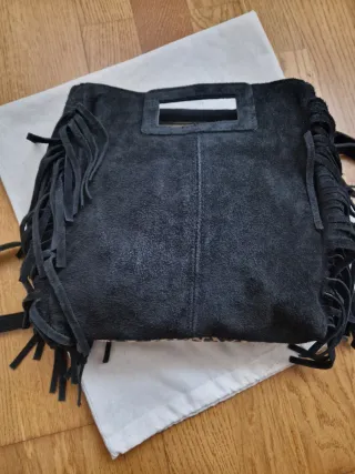 Bolso de piel con flecos y estampado animal