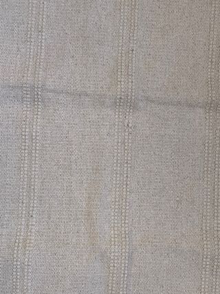 Alfombra pequeña beige