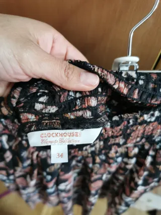 Falda corta vuelo negra estampada XS