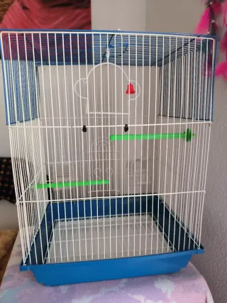 Jaula para pájaros azul y blanca