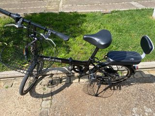 Bicicleta plegable negra en perfecto estado