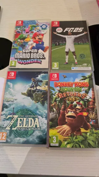 Nintendo Switch OLED + 4 juegos + funda
