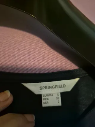 Blusa azul marino con volantes