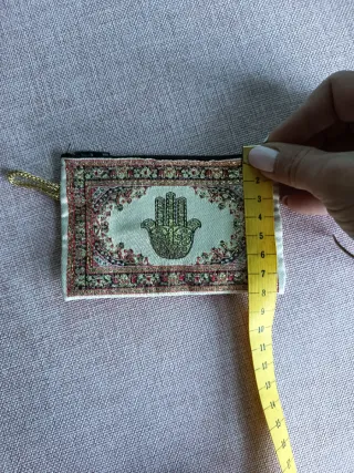 Cartera con mano de Fátima