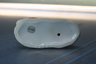 Porcelana Casades: Figura de bebé con magdalena. Vintage.