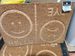 Tappeto d'ingresso Hello Bye con facce sorridenti/tristi