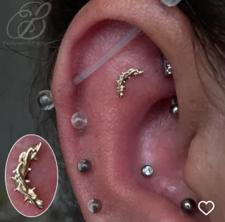Piercing de oro diseño arco de espinas de Junipurr