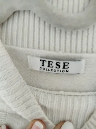 Suéter blanco de cuello alto