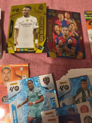 Lata y cromos Adrenalyn 25-26