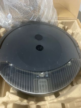 Robot aspirador Roomba con base