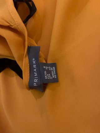 Blusa amarilla manga larga con lazo